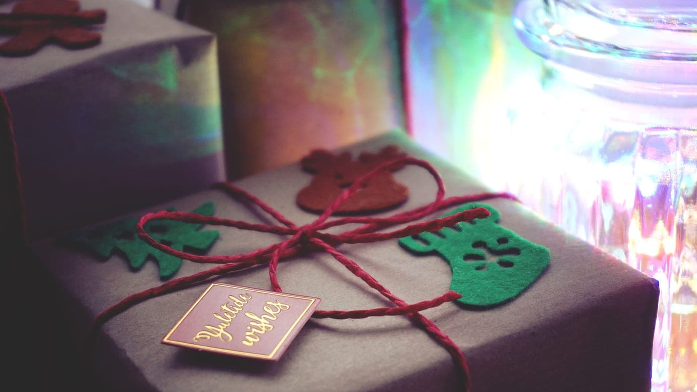 Wrapped presents with ribbon in warm indoor light